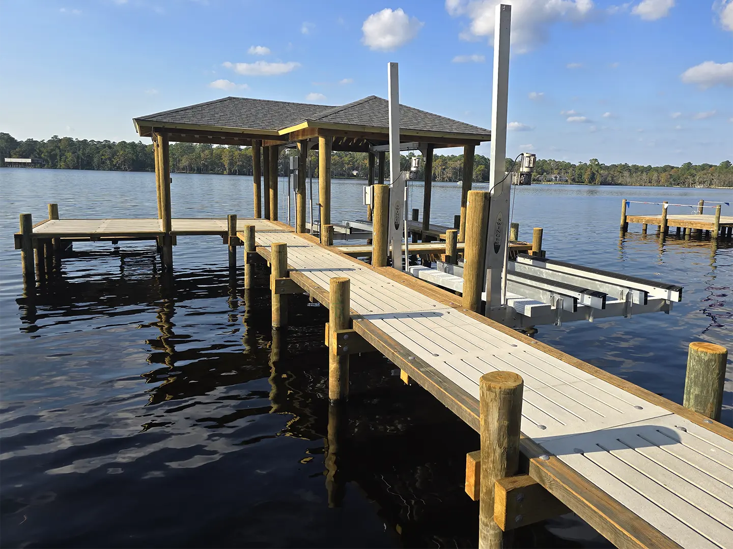 Ultimate Hog Slat Dock with Boathouse, Boat Lift, Jetski Lift, Covered Platform and Lowered Swim/Kayak Platform on Trent River