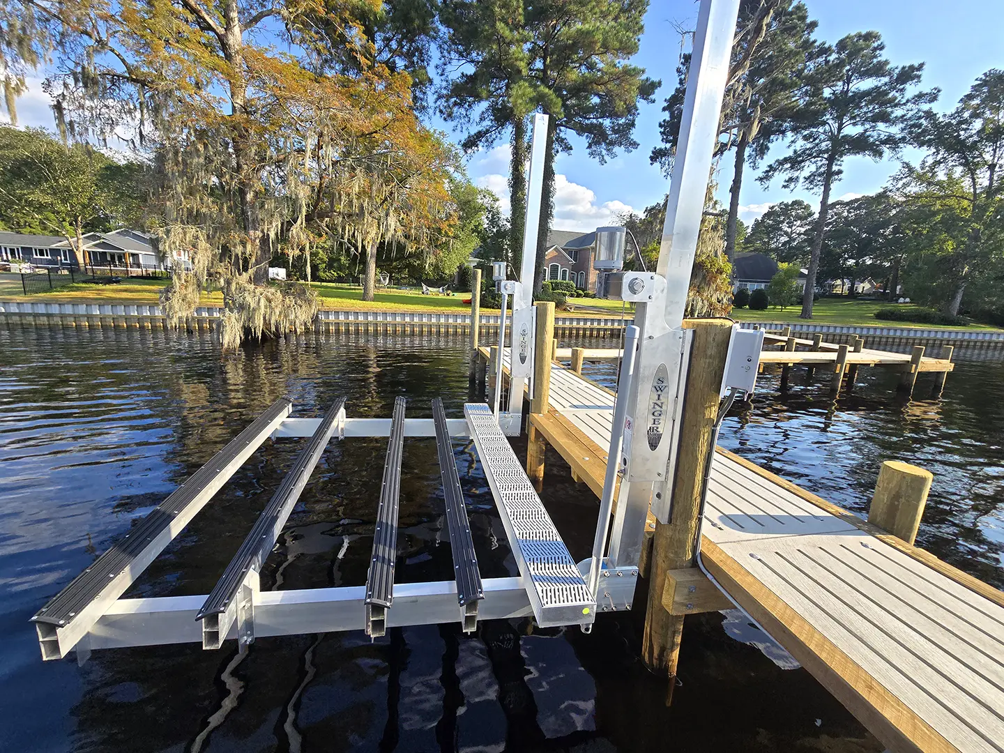 Ultimate Hog Slat Dock with Boathouse, Boat Lift, Jetski Lift, Covered Platform and Lowered Swim/Kayak Platform on Trent River