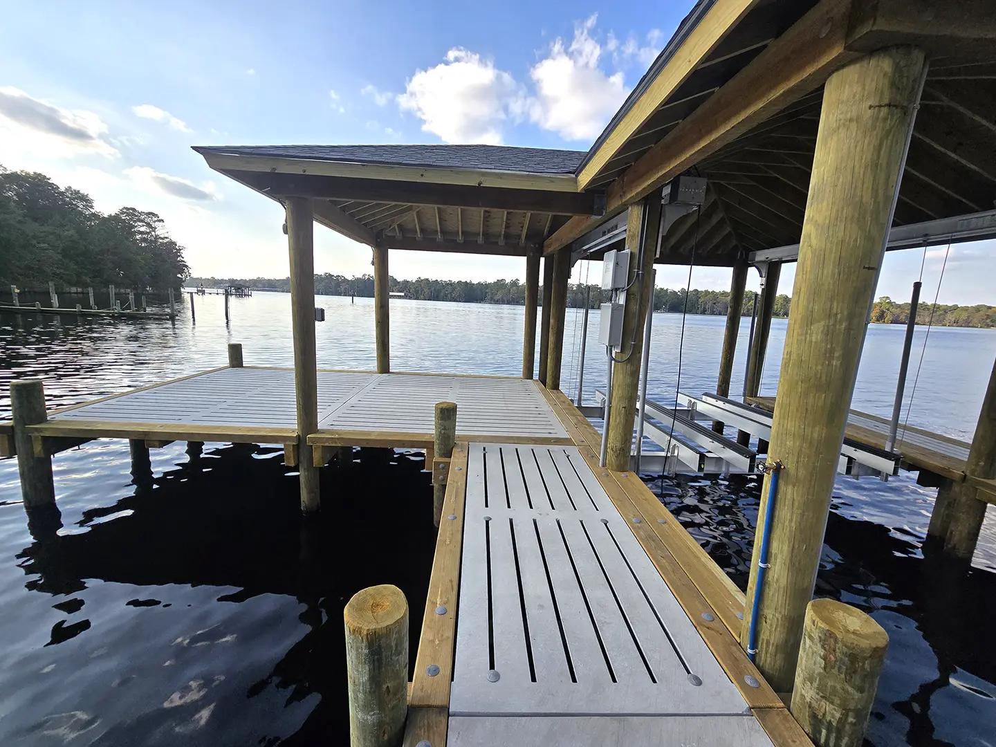 Ultimate Hog Slat Dock with Boathouse, Boat Lift, Jetski Lift, Covered Platform and Lowered Swim/Kayak Platform on Trent River