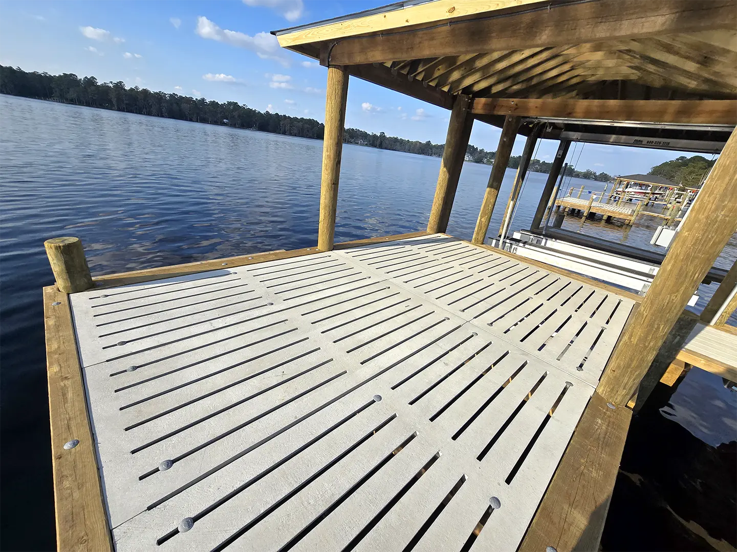Ultimate Hog Slat Dock with Boathouse, Boat Lift, Jetski Lift, Covered Platform and Lowered Swim/Kayak Platform on Trent River