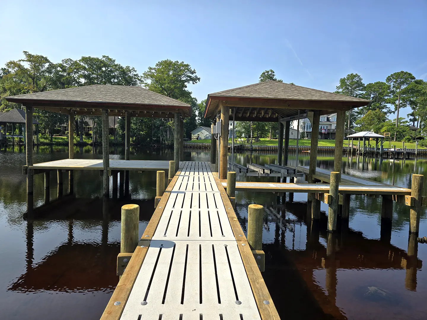 Brices Creek hog slat dock with boathouse & boat lift and covered platform