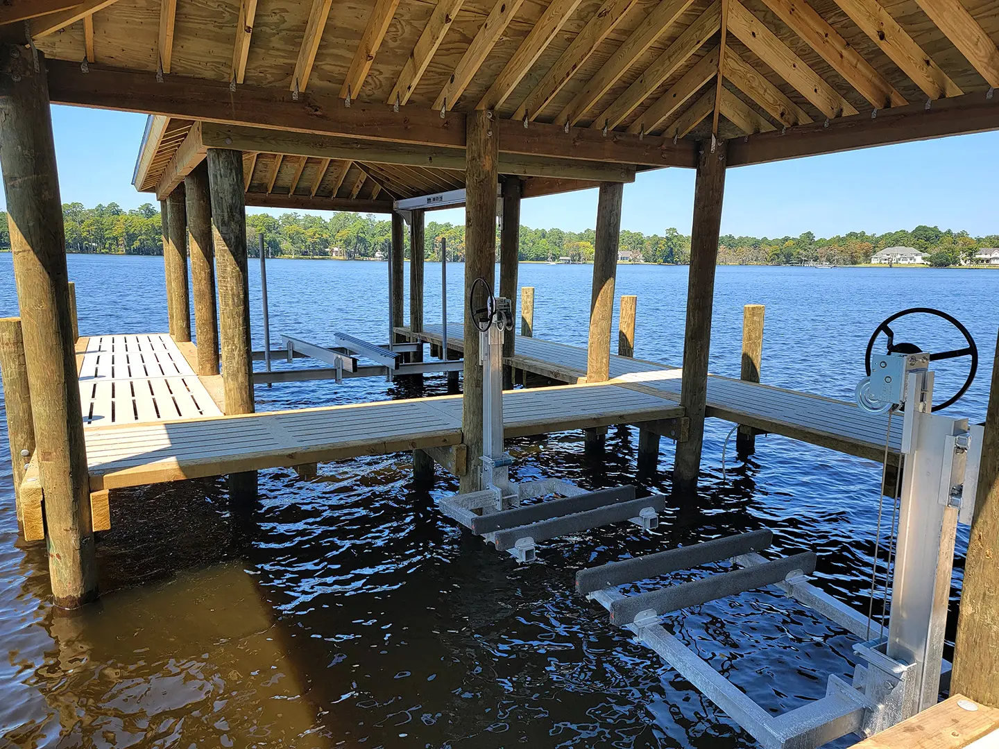 Hog Slat Dock with Boathouses, Boat Lift, Jetski Lift and Boat Ramp on Trent River