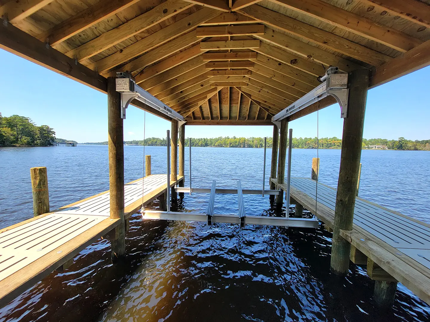 Hog Slat Dock with Boathouses, Boat Lift, Jetski Lift and Boat Ramp on Trent River
