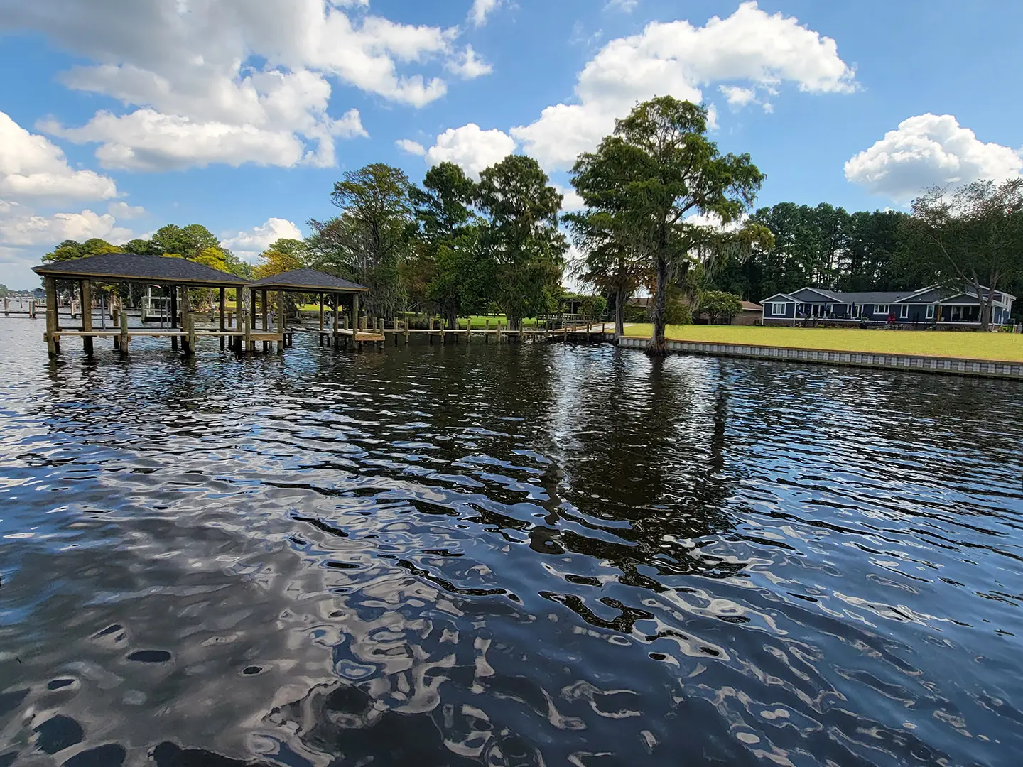 Hog Slat Dock with Boathouses, Boat Lift, Jetski Lift and Boat Ramp on Trent River