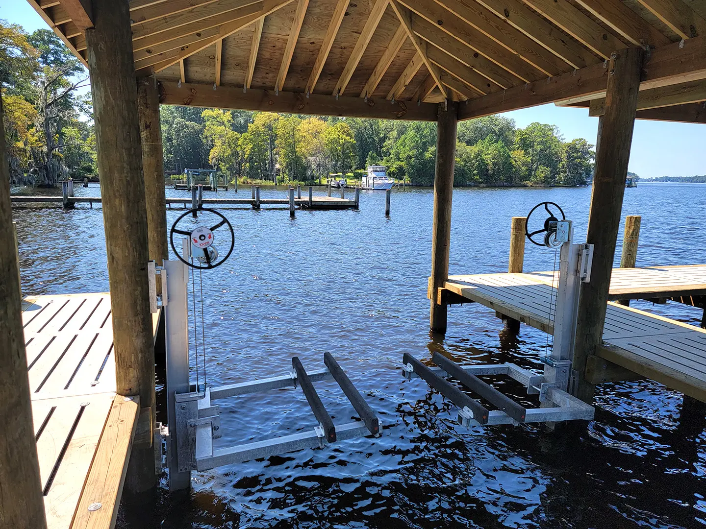 Hog Slat Dock with Boathouses, Boat Lift, Jetski Lift and Boat Ramp on Trent River